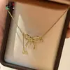 Popular Collar de Oro con Lazo y Diamantes de Alta Gama de Xiaohongshu para Mujer Estilo Ins Exquisito Nicho Collar Francés