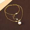 Collar con colgante de perla roja Ankora de estilo simple para mujer, versátil para otoño e invierno, de alta gama, lujo ligero, nicho, elegante, cadena para la clavícula