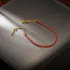 Nuevo Pulsera Tejida de Buena Suerte Estilo Chino con Chapado de Cobre Oro Real de 18K, Hilo Rojo Pequeño, Sensación Moderna y de Alta Gama, Pulsera Festiva de Año Nuevo para Mujeres
