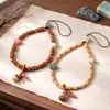 Estilo Zen semente de maracujá cordão de celular estilo étnico retro borla de rudraksha estilo bolsa da sorte cordão de celular curto