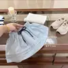 Conjunto de Niña 2026 Verano Nueva Moda Chaleco de Punto POLO y Falda Corta a Cuadros Conjunto de Dos Piezas Estilo Moderno