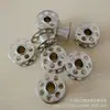 0115367000 (ZY108) Carrete moleteado Carrete para máquina doméstica Carrete especial para máquina de coser bernina
