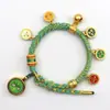 Pulsera tejida a mano estilo Tíbet con Cinco Deidades de la Riqueza, Pulsera Thangka, Colgante Ojo del Dharma del Dios de la Riqueza, Pulsera de Hilo Rojo con Cascabel