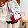 Bolsa de maquillaje de gran capacidad 2024 primavera costura de color contrastante bolso tote mochila de viaje femenina bolso de mano simple para el trabajo