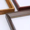 Fabricante mayorista de molduras para marcos de fotos molduras de madera maciza para marcos de fotos tiras decorativas de madera blanca líneas de marcos de espejos grandes cantidades precios favorables