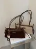 Bolso de axila de nicho estilo francés para mujer, nueva colección otoño/invierno 2026, bolso de hombro casual retro, bolso baguette de alta gama para el trabajo