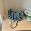 Bolso de mezclilla estilo retro biker americano para mujer, nueva moda 2026 versátil casual de alta gama para hombro o axila