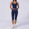 Camisola de yoga estilo europeo y americano con cuello halter de tacto desnudo, tipo dos piezas falsas, adelgazante y levantadora de glúteos, adecuada para deportes casuales y fitness