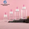 Disponibles en stock botellas de vidrio transparente con fondo redondo y hombros redondeados, con gotero, de 30 ml a 120 ml, botellas para suero, botellas para aceites esenciales, botellas dispensadoras, materiales de embalaje