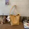 Bolso Pequeño Versátil de Alta Gama para Cruce de Fronteras de Gran Capacidad Estilo Nuevo Primavera 2026 Bolso de Hombro Único para Debajo del Brazo de Mujer Bolso Cubo