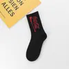 Nuevos calcetines altos de letras ins Cola estilo coreano personalizados medias hip hop marca de moda callejera europea y americana calcetines para parejas hombres y mujeres