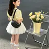 Bolso de hombro infantil transfronterizo, estilo minimalista, 2026, para niñas, con una estética suave y pastoral, un bolso pequeño lindo y un diseño dulce cruzado
