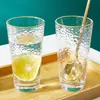 Venta al por mayor de fábrica vaso de vidrio con patrón de ojo de martillo y borde dorado artificial vaso para jugo patrón de martillo Taza de leche Taza de té ins mercado nocturno
