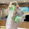 Llavero de taza de té de leche arcoíris nuevo y creativo y botella de arena líquida, lindo accesorio para bolso, exquisito llavero para coche