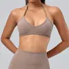 Sujetador deportivo ecológico de poliéster reciclado y spandex con cuello halter en V para mujer, con tirantes ajustables y almohadillas en el pecho para yoga y fitness