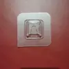 Botón a presión adhesivo fuerte sin costuras colgante no perforado parche de doble cara gancho transparente hebilla suministro de fabricantes