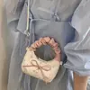 Bolso de Mano Plegado con Lazo Estilo Coreano de Nicho para Mujer Primavera 2026, Nuevo Bolso de Hombro Chic de Moda para el Trabajo