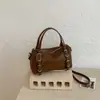 Bolso de mano texturizado de nicho transfronterizo, bolso tote pequeño para mujer, nuevo modelo 2026, bolso tipo almohada simple, bolso versátil de hombro y cruzado