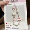 Cadena Minimalista para Teléfono con Perlas y Lazo, Correa de Muñeca, Cadena de Mano, Portacámaras y Llavero para Mujer