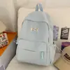 Nueva mochila escolar de alta gama transfronteriza para estudiantes de secundaria femeninas, estilo universitario, color sólido, gran capacidad, simple, versátil.