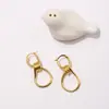 [18] joyería de latón chapado en oro de comercio exterior moda simple nudo espiral personalidad aretes aretes