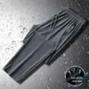 Calça Esportiva Estilo Hong Kong Masculina de Perna Larga Cropped na Altura do Tornozelo Casual Reta Longa Moda Versátil Bolso com Zíper Calça de Moletom