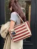 Bolso de mano tejido a rayas de moda transfronterizo 2026 nuevo versátil para el trabajo bolsa grande estilo coreano de gran capacidad para mujer