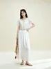 Conjunto de Dos Piezas Calado Bordado Francés Original Nanyou 2026 Verano Top Corto con Cuello en V y Lazos Falda Larga de Cintura Alta Resort