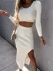 Otoño e invierno 2022 Europa y Estados Unidos comercio exterior transfronterizo nuevo para mujer color liso manga larga moda sexy falda larga con abertura conjunto de dos piezas