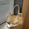 Bolso grande de moda retro para mujer 2026 nuevo bolso casual simple para el antebrazo bolso tote de hombro texturizado para el trabajo