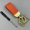 Llavero de coche de piel de cordero francesa creativo exquisito colgante de llave cadena de llaves de metal anillo de llaves de moda roja al por mayor
