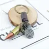 Llavero creativo para hombre y mujer, regalo pequeño, aleación, bala, tejido vintage de cuero, llavero con colgante de cuero