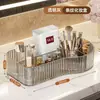 Caja de almacenamiento de maquillaje compartimentada transparente a rayas de lujo ligero para tocador, organizador de escritorio para lápices labiales y brochas de maquillaje
