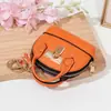 Mini bolso de concha de celebridad de internet llavero bolso de mano monedero colgante de bolsa portátil para guardar labial auriculares bolsa pequeña