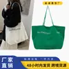 Bolsa de Hombro Grande de Lona Estilo Nuevo 2026 Lona Ecológica para Viajes de Negocios Compras Nicho Bolsa de Axila Verano