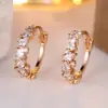 Pendientes irregulares con incrustaciones de diamantes de alta venta transfronteriza Rongxing con disposición de diamantes brillantes de múltiples formas Pendientes de aro en forma de C para banquetes