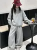 Conjunto de primavera y otoño para niñas 2026 nuevo conjunto deportivo de dos piezas moderno estilo coreano con sudadera y pantalones de pierna ancha para niñas mayores