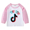2026 Nueva Camiseta Infantil Transfronteriza de Primavera y Otoño Cuello Redondo Dibujos Animados Manga Larga Camiseta Básica para Niños y Niñas Camiseta de Algodón para Bebé