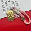 Ano do Carneiro Ouro Puro 999 Flor de Dinheiro Chaveiro de Cordeiro Alça para Celular Pingente de Bolsa Souvenir de Negócios de Alta Qualidade