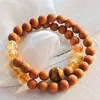 Pulsera con Diseño Multicírculo de Sándalo Natural, Cristal Amarillo y Ojo de Tigre