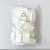 50 piezas por paquete de almohadillas de algodón comprimido para tatuajes, almohadillas de algodón desmaquillantes con patrón de perla empaquetadas individualmente, almohadillas portátiles con forma de caramelo para salones de belleza