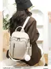 Bolso de hombro doble mochila de viaje de nailon ligera transfronteriza para mujer, moda de oficina, nueva versión coreana, gran capacidad, versátil
