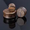 Expansor de oreja redondo de sándalo dorado liso de alta densidad cruzado original popular al por mayor joyería perforada