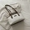 Bolso de mano elegante y versátil para mujer, nueva colección 2026, moderno y chic, adecuado para ir al trabajo, bolso de hombro, diseño de lunares, se puede llevar debajo del brazo
