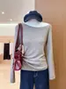 Camiseta negra de manga larga para mujer, moderna, con diseño de hombros descubiertos, corte ajustado, estilo corto, nueva llegada de primavera