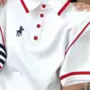 Camiseta Bordada de Manga Corta con Botones y Solapa Talla Grande para Mujer Primavera y Verano 2025 Nuevo Top de Moda Holgado que Adelgaza y Cubre la Piel para Mujer
