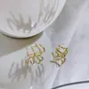 Pendientes de fila de oreja de cuatro garras Diseño de nicho Sentido de la moda Pendientes de celebridad de internet Personalizados Lujo ligero Elegante Estilo frío Nuevos Pendientes 2025