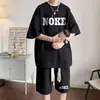 Camiseta Trendy de Manga Corta Estilo Americano para Hombre, Nuevo Conjunto Deportivo Casual Verano 2026, Corte Holgado con Pantalones Cortos a Juego