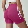 Pantalones cortos de entrenamiento de yoga de tres cuartos de alta elasticidad, control de abdomen, color sólido y bloques de color, transfronterizos europeos y americanos, para ciclismo al aire libre, pantalones cortos de melocotón