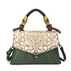Bolsa de Mão Feminina Estilo Étnico Retrô da Marca 2026 Nova Moda Elegante e Estilosa Bolsa de Ombro Transversal para Mães de Meia-Idade